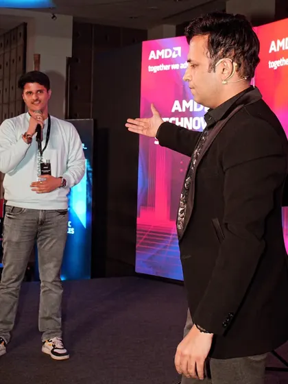 Interacting with a volunteer from AMD. My goal is to create a comfortable and fun atmosphere on stage, so the audience volunteers can enjoy their moment in the spotlight.