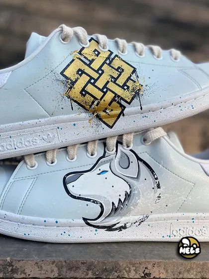 A detailed close-up of the hand-painted Karma symbol and the white wolf's face.