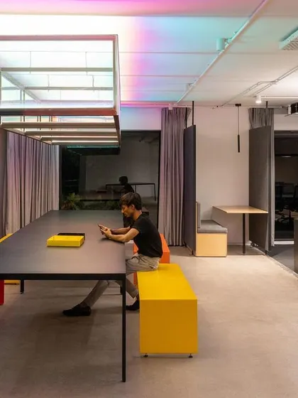 Another view of the Community Table, a flexible space for collaboration in our studio. The design combines a long, functional table with our own informal bench seating, creating a versatile zone that adapts to the changing needs of our team throughout the day.