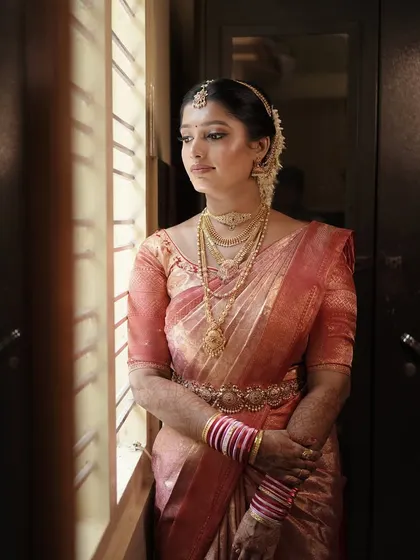 The complete traditional bridal look. I focus on creating a cohesive style where the makeup, hair, and saree draping all work together to create a picture of elegance.