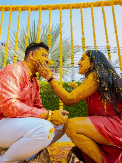 A sweet, intimate moment after the Haldi chaos. Sonali playfully applies turmeric to Garv's face, a beautiful candid shot that captures their connection.
