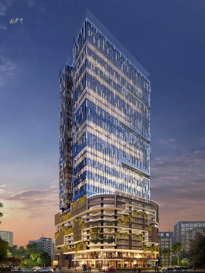 A nighttime render of Codeword Edge. The lighting design emphasizes the building's unique form and its integration of green spaces within the podium levels.