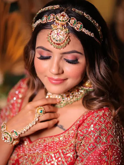 A close-up on the soft, rosy eye makeup and flawless skin. This is the kind of detail and precision we teach, ensuring every element of the makeup is perfect.