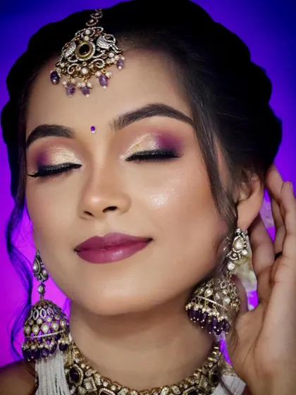 A close-up on the eye makeup, showing how the purple tones of the jewellery can be used as inspiration for the colour palette. A great detail shot for a makeup portfolio.