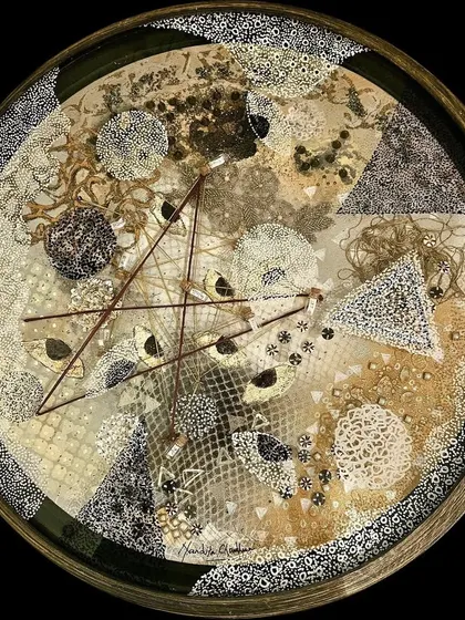 A detailed view of an 'Alchemical Circle' by Nandita Chaudhuri, inviting the viewer into a world of delicate balance and cosmic abstraction.