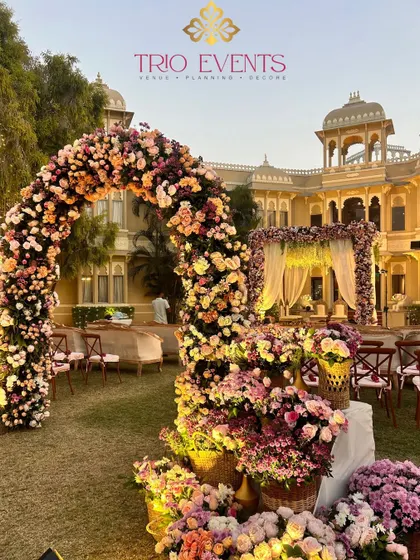 A breathtaking floral mandap at Justa Rajputana, Udaipur. The archway and aisle are covered in thousands of fresh flowers, creating a truly magical path for the bride.