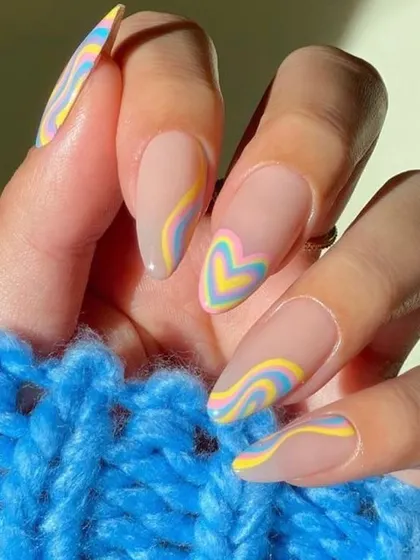 Perfect for summer, this design features wavy lines and a heart shape in pop colors. You will learn how to create playful and trendy nail art that follows seasonal demands.