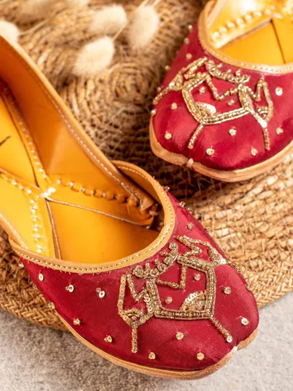 This shot of a red jutti highlights the unique, festive embroidery. Our goal is to create images that not only show the product but also tell a story about its style and occasion.