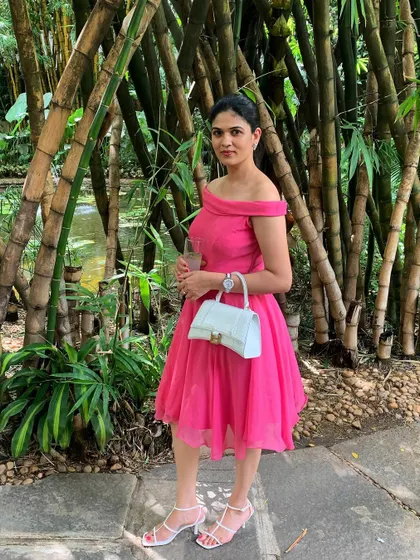 A perfect dress for a birthday or daytime party. I designed this piece in a bright pink fabric with a classic off-the-shoulder neckline and a flared, knee-length skirt for a fun and feminine look.