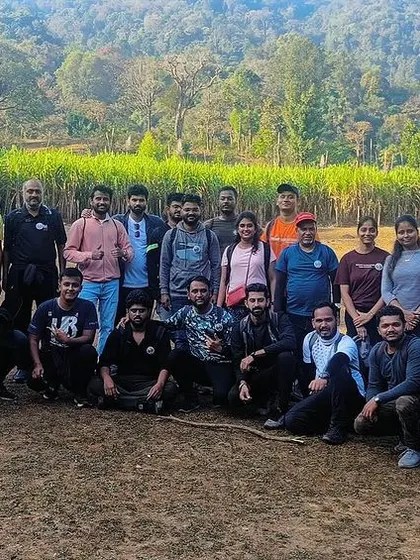 A large group ready to begin their trek. We can manage all the logistics for corporate teams looking for an authentic adventure in the Western Ghats.