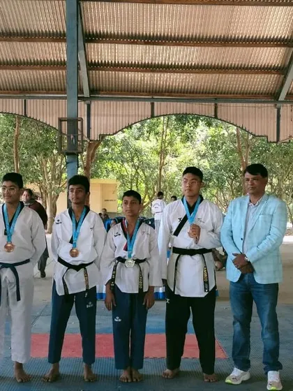Our students displaying their medals after a successful competition. We build a team that supports each other and celebrates success together.