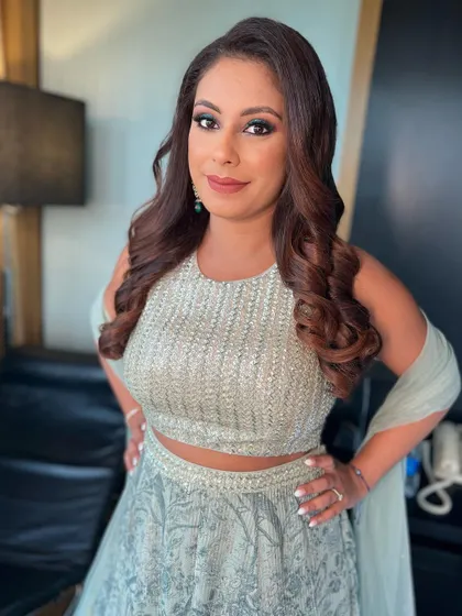 A perfect example of a glamorous party look. I created a dramatic smokey eye with a pop of shimmer on the inner corner and paired it with voluminous curls for a stunning effect.