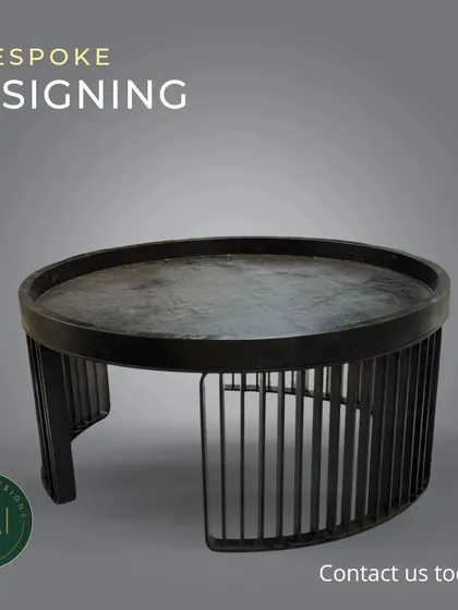 A minimalist coffee table with a tray-top design and a slatted metal base. This piece combines industrial and modern elements for a look that is both simple and sophisticated.
