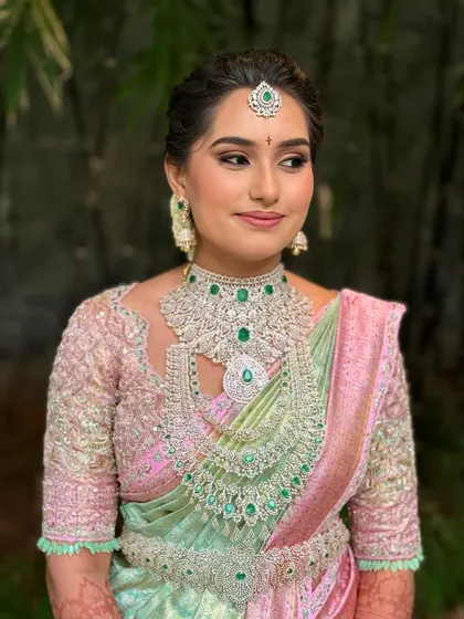 Manasa's full bridal look, showcasing her unique pastel saree and stunning diamond jewelry. The makeup is kept fresh and luminous to complement the modern color palette.