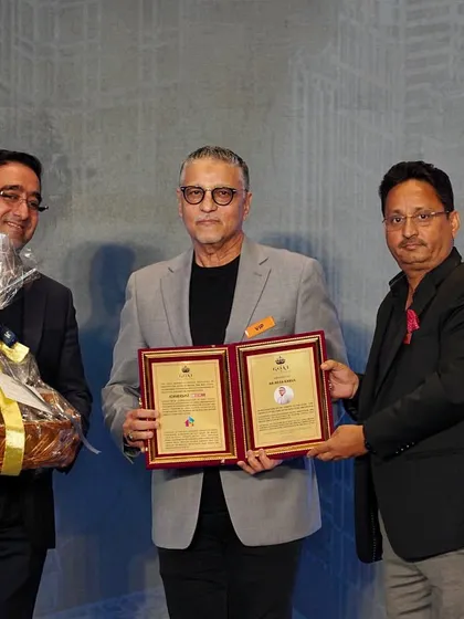 Receiving the plaques for the GOAT award from CREDAI MCHI. A heartfelt thank you to the organizers for this honor.