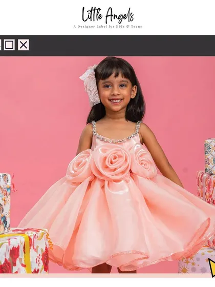Our "Flower Dress" in peach, featuring large 3D roses and a voluminous organza skirt.