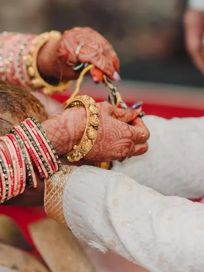 A duplicate of 316, showing the hands of the couple and their parents during a key ritual.
