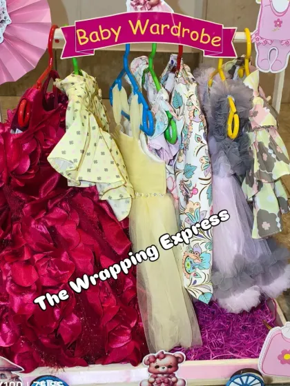 A full view of the baby girl's wardrobe section, showcasing the beautiful dresses.