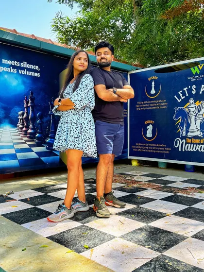 A couple poses on our giant outdoor chessboard at the Nandi Hills resort. Our properties have many fun and quirky spots for memorable photos.
