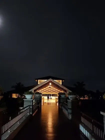 The moon casts a gentle glow over our yoga hall. This view captures the serene and almost magical quality of the retreat at night, a perfect setting for evening meditation and quiet reflection.