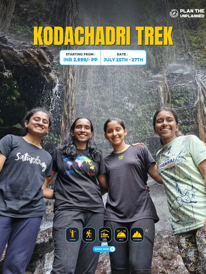 A group of four friends enjoying the waterfalls along the Kodachadri route. Our treks are designed for making memories together.