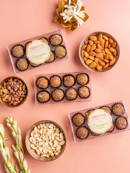 Here is a closer look at my nutritionist-approved laddoos, surrounded by their wholesome ingredients like cashews, almonds, and pistachios. It's a gift of health and love for Raksha Bandhan.