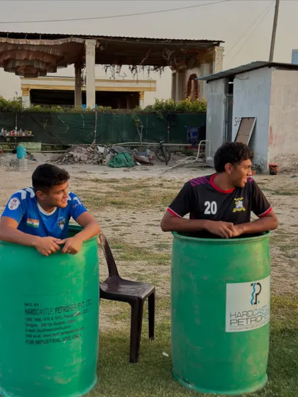 Two players enjoying a well-deserved ice bath after an intense training session. This is essential for muscle recovery and injury prevention.