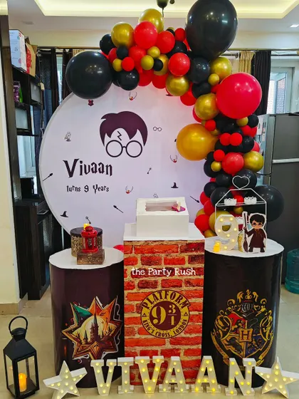 For Vivaan's 9th birthday, I created this magical Harry Potter setup. It includes a custom backdrop with the iconic glasses and scar, plinths representing the Hogwarts houses, and a Platform 9 3/4 detail.