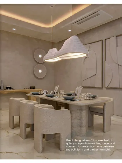 This dining room showcases our belief that great design quietly shapes how we feel. The sculptural light fixture and chairs create harmony between the built form and the human spirit.
