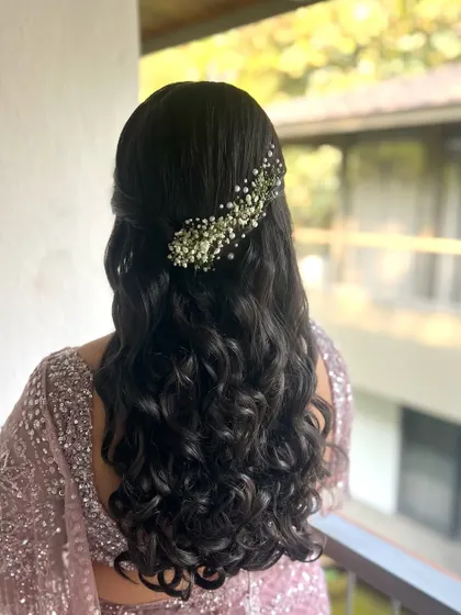 The final look of the baby's breath half-updo. It's a timeless and ethereal style that is perfect for any special occasion.