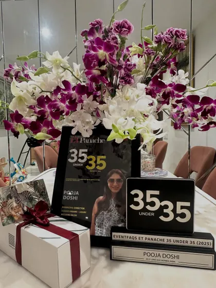 The award, a beautiful bouquet, and a celebratory gift. A cherished memory of the recognition for all the hard work and sleepless nights.