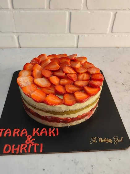 A beautiful Strawberry and Pistachio cake, customized for a client. The layers of vanilla sponge, pistachio cream, and fresh strawberries make it a light and delicious choice.