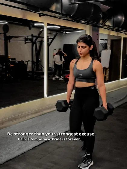 This is the focus and determination we build every day. We guide you to be stronger than your excuses, using tools like dumbbells for farmer's walks to build grip strength and full body stability.