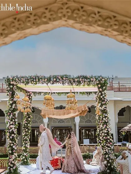 A wedding ceremony framed by a beautiful archway, another one of my shots featured by Incredible India.