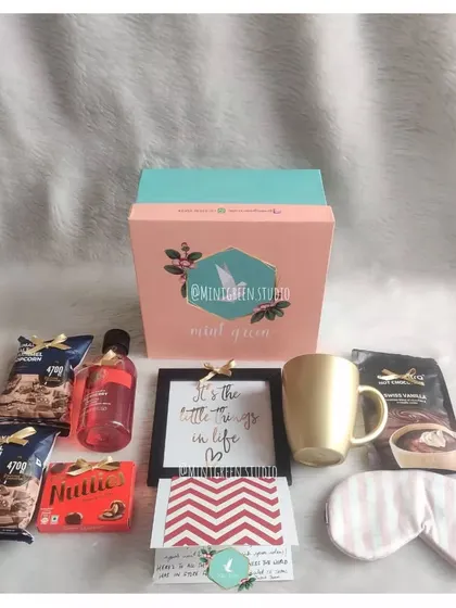 This hamper was designed for a manager, striking the perfect balance between professional and personal. It includes chocolates, a gold mug, a relaxing eye mask, body wash, and a framed motivational quote, all packed in our signature box.