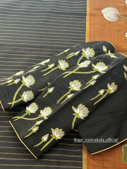 The full layout of the black lotus-painted blouse.