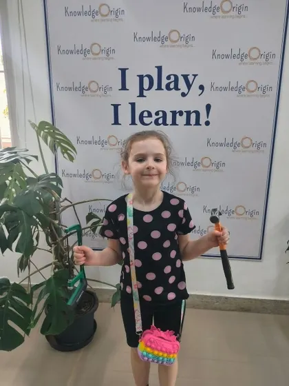 A happy camper with her tools. The small group size at my camps ensures that every child gets individual attention and guidance.