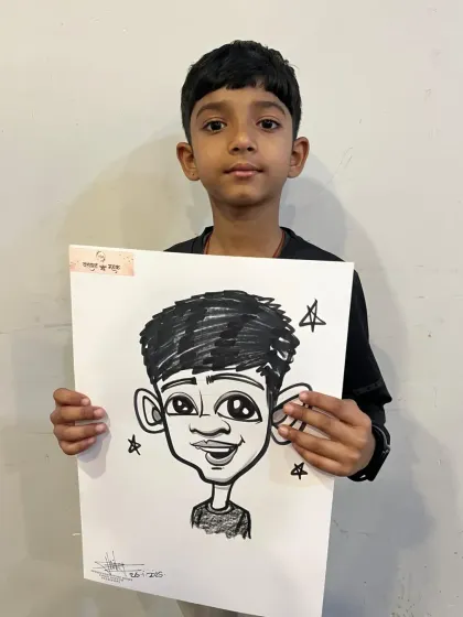 A young boy from the same wedding event, happy with his new portrait.