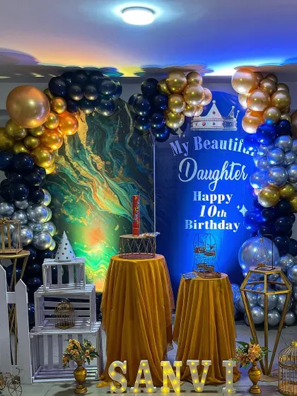 Another view of the elegant golden balloon theme, showing the beautiful lighting and backdrop.
