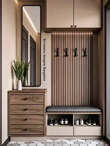A sleek and modern entryway unit with a built-in bench for seating. The design includes shoe storage cubbies, coat hooks on a fluted panel, and a full-length mirror.
