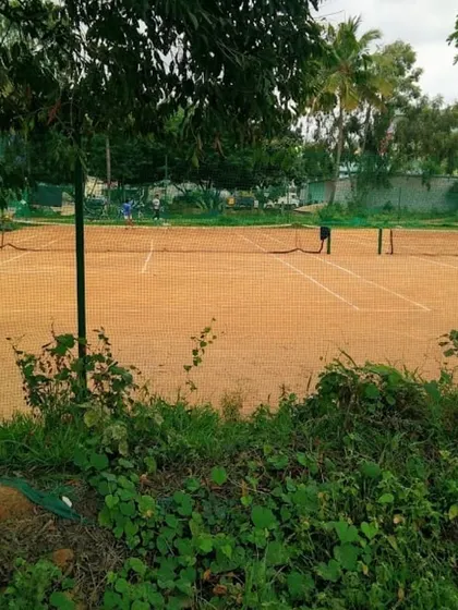 A clear view of one of our classic red clay courts. We maintain our facilities to ensure a professional and enjoyable playing experience for everyone.