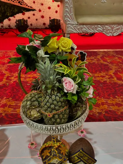 A basket of pineapples, each decorated with a small, delicate chain. This is another example of how I add small, thoughtful details to make every platter special.