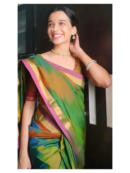 A closer look at the details of my traditional attire for a cultural event. From the classic jewelry to the way the saree is draped, every element is considered to present an authentic and respectful performance.