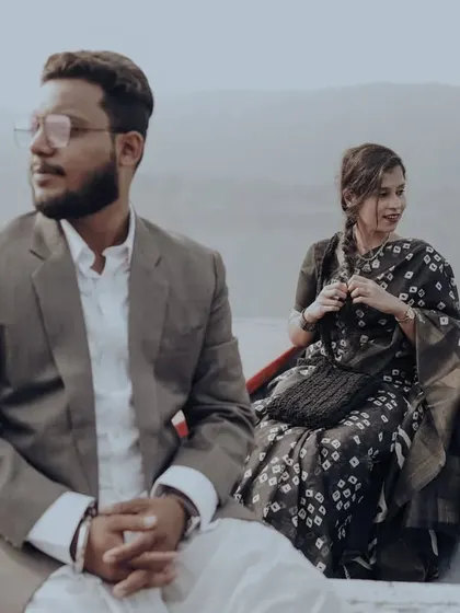 A cinematic shot of the couple on a boat, creating a story-driven and moody pre-wedding photograph.