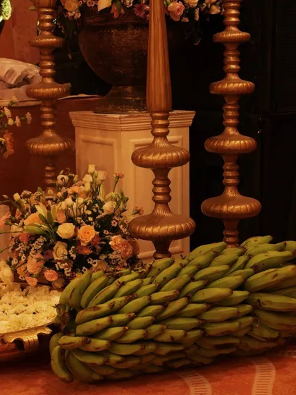 A close-up of the brass finials and banana bunches, essential elements in many traditional Indian ceremonies, which we seamlessly integrate into our overall design.