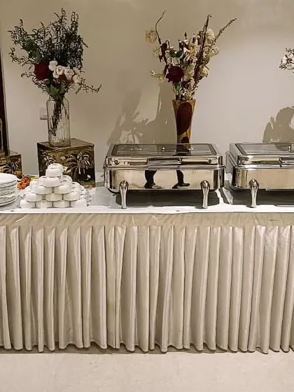 A compact and elegant buffet for a gathering of 25, showcasing our attention to detail with decorative accents and neatly arranged dishes.