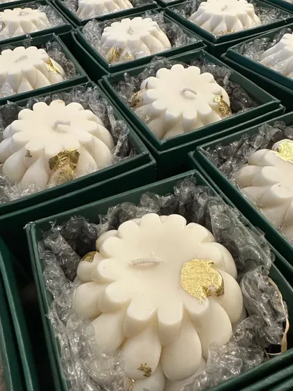 A large batch of my braided candles with gold leafing, ready to be dispatched for a 50th birthday party. Each one is scented with calming lavender essential oil.