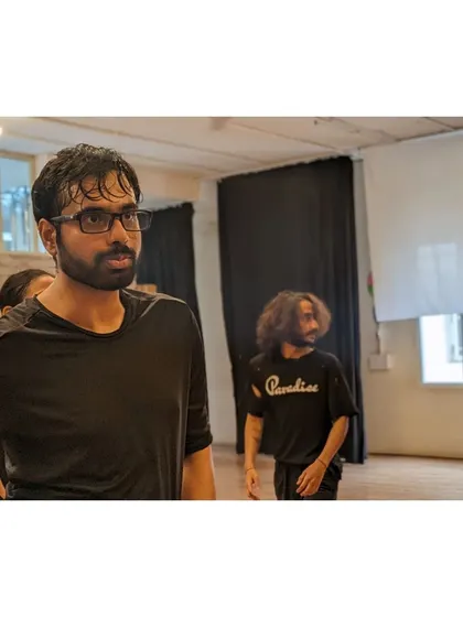 A student in deep focus during a contemporary dance drill.