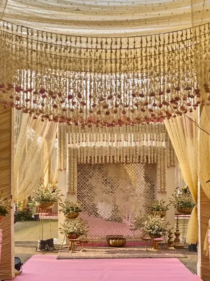 A straight-on view of the enchanting entrance, with its canopy of thousands of hanging flowers creating a breathtaking floral ceiling.