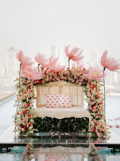 The bridal seating, seemingly floating on water, with the Mumbai skyline in the background. A truly magical setting for a mehendi.
